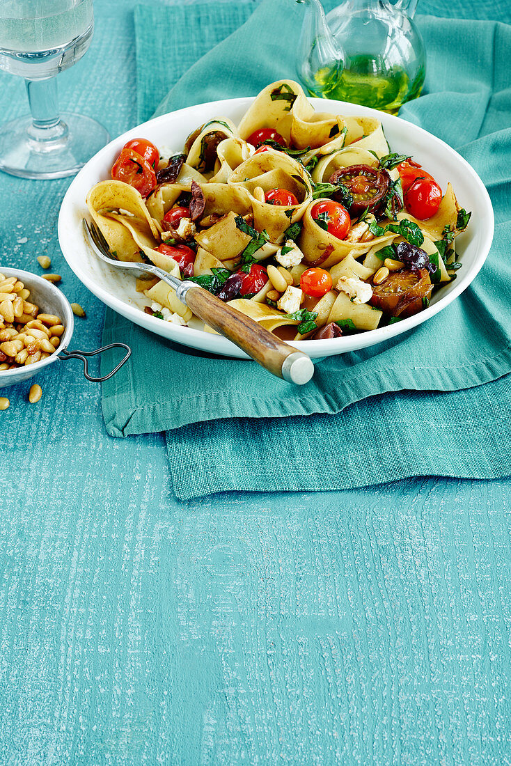 Pasta with pine nuts, feta and tomato