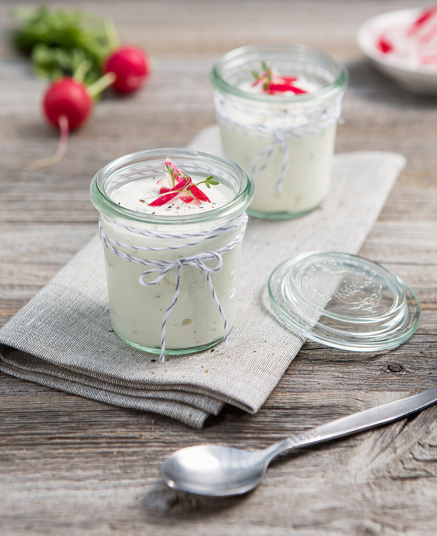 Herb quark with radishes in jars