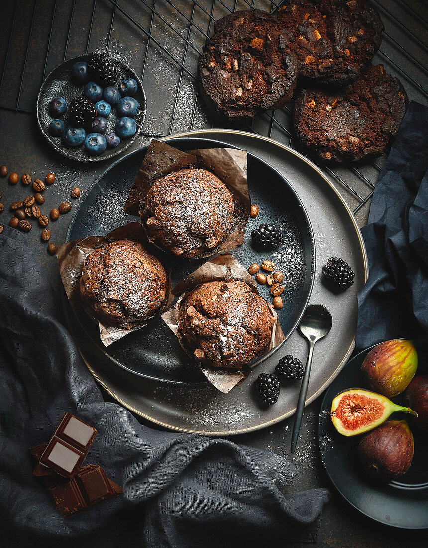Coffee and chocolate muffins with berries