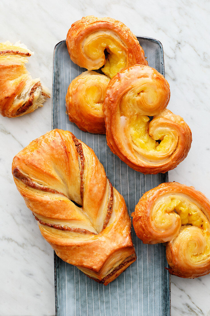 A nut pastry and vanilla puff pastry buns