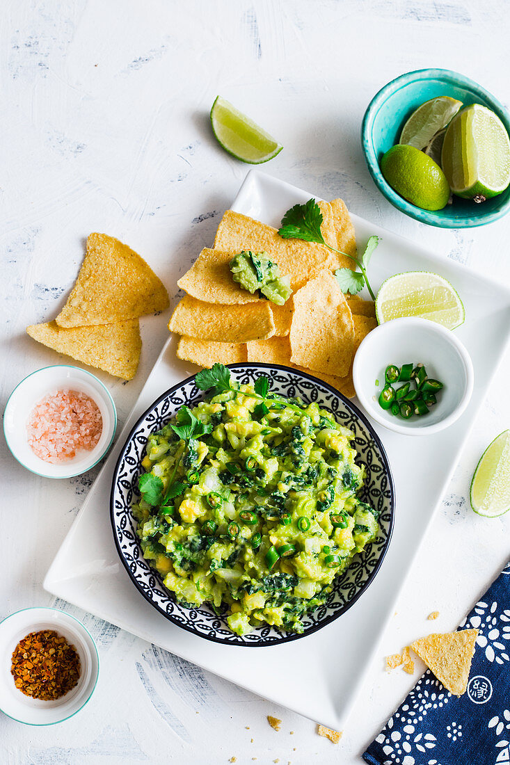Mexican guacamole with a twist of kale, served with corn chips (totopos)