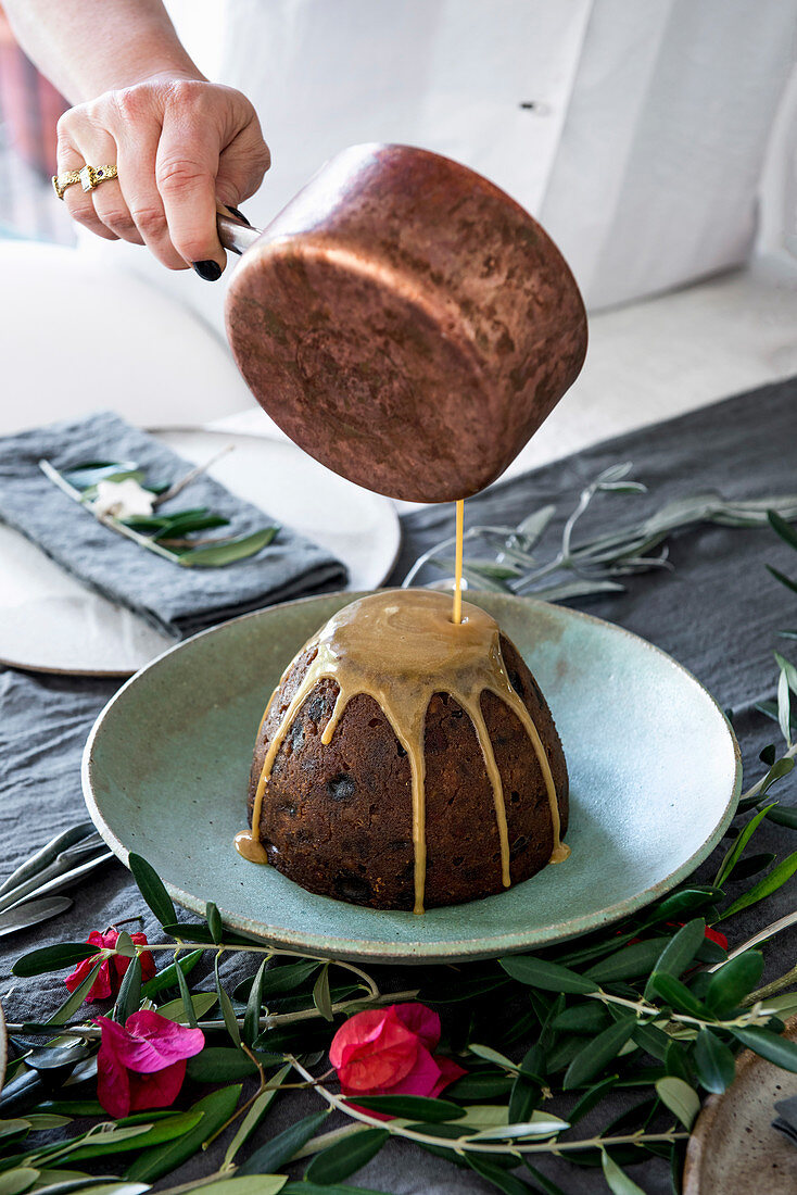 Pour sauce over Christmas pudding