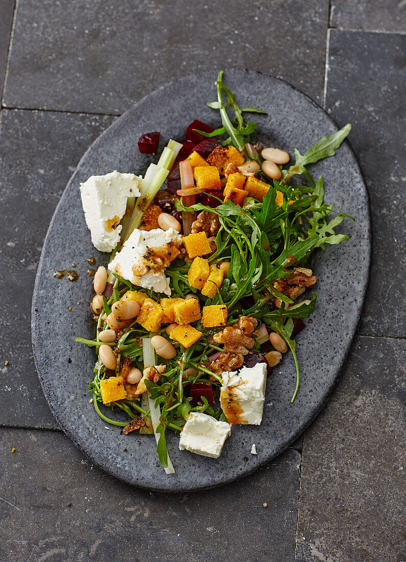 Bean salad with rocket, beetroot, feta cheese and polenta croutons