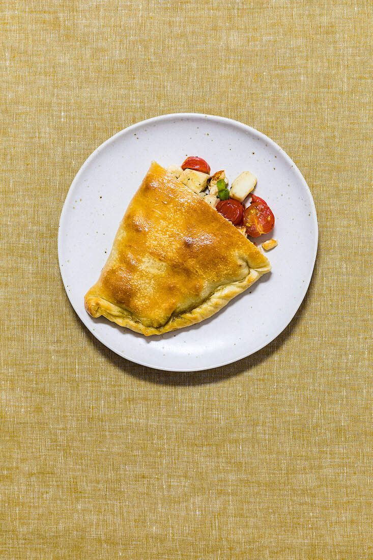 Calzone filled with halloumi and tomatoes