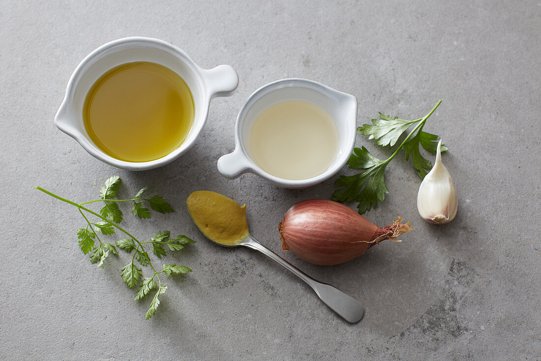 Ingredients for a dressing – shallots, oil, garlic, mustard, herbs and vinegar