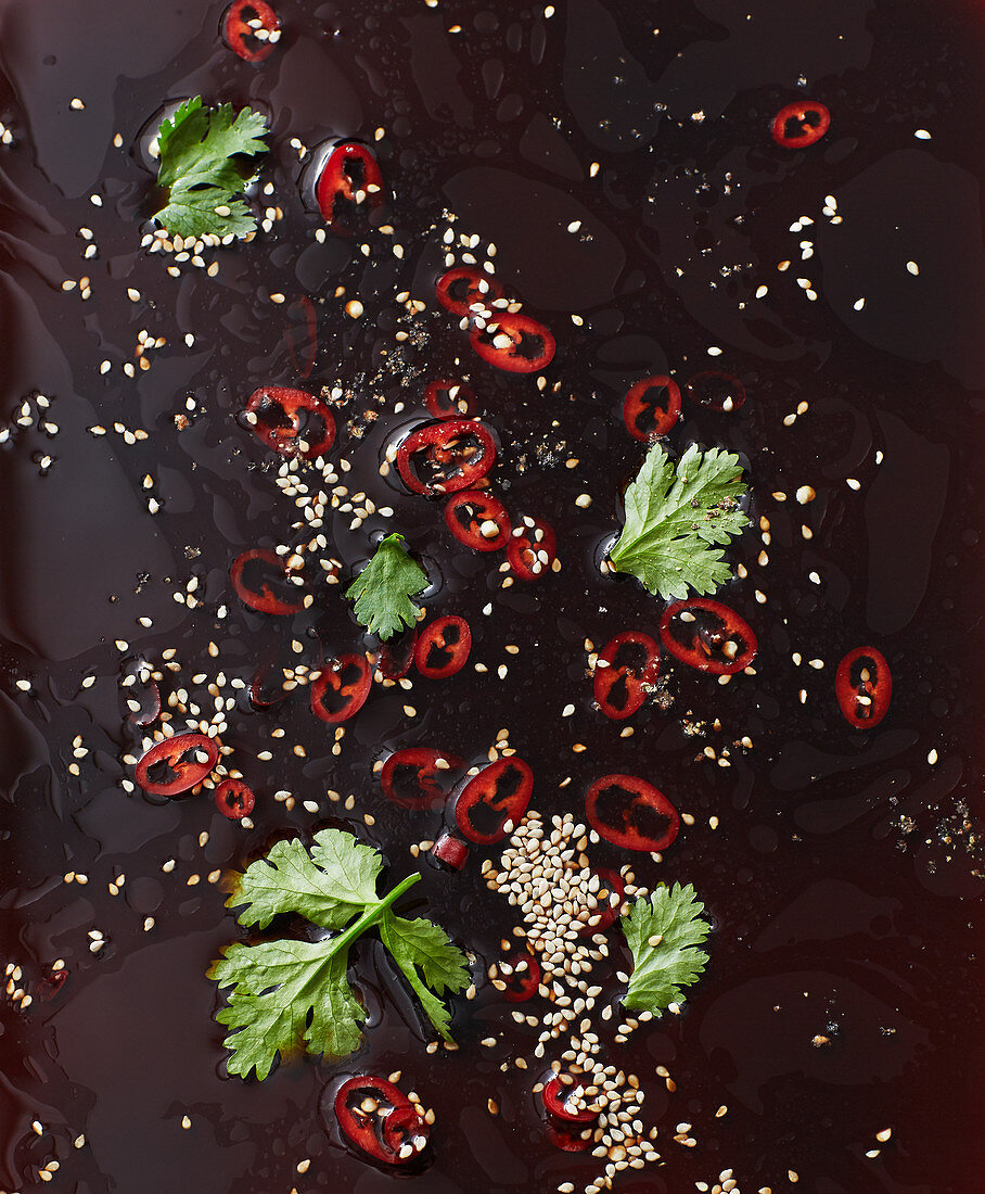 A dressing with sesame seeds, chilli and coriander