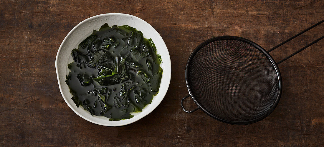 Dried wakame being softened in water