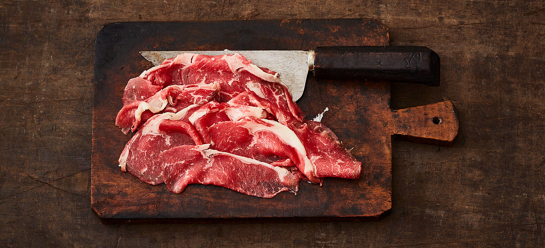 Meat being frozen before being chopped