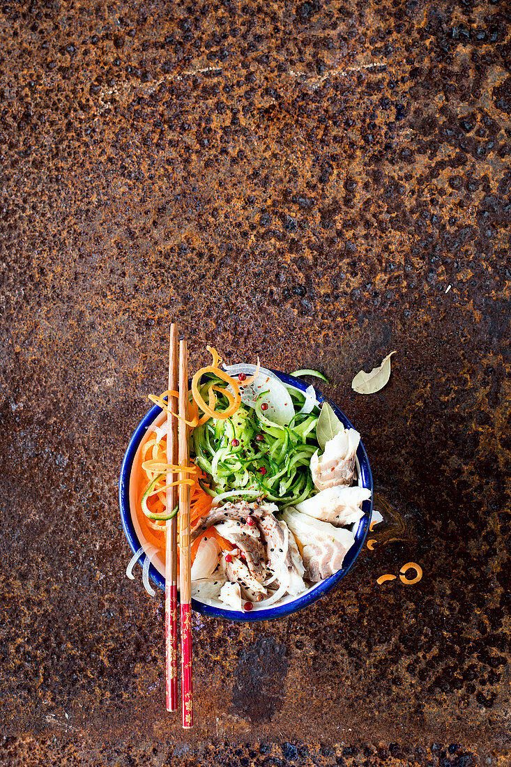 Salad with carrots, cucumber, onion and fish