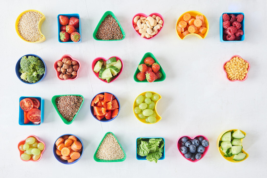 Fruit, vegetables, seeds and nuts in various containers