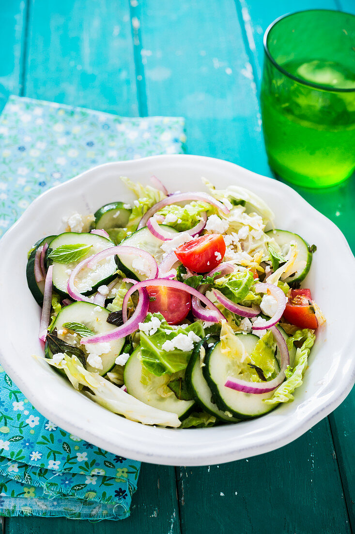 Summery cucumber salad with tomatoes and onions