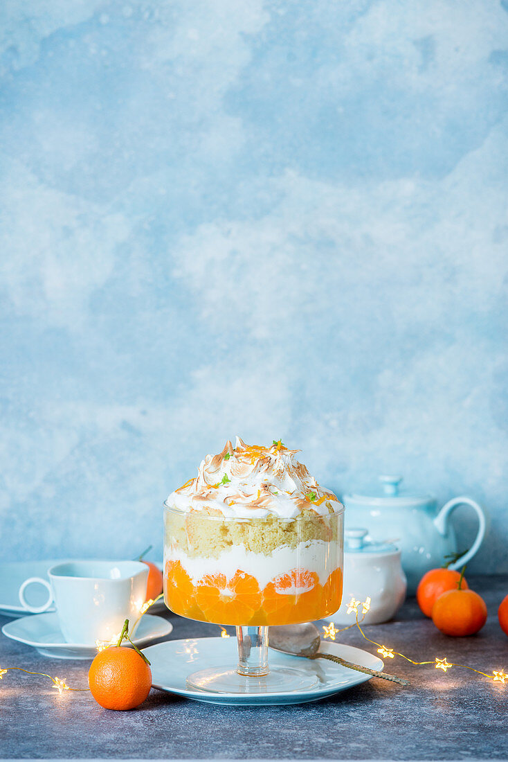 Tangerine trifle on concrete background