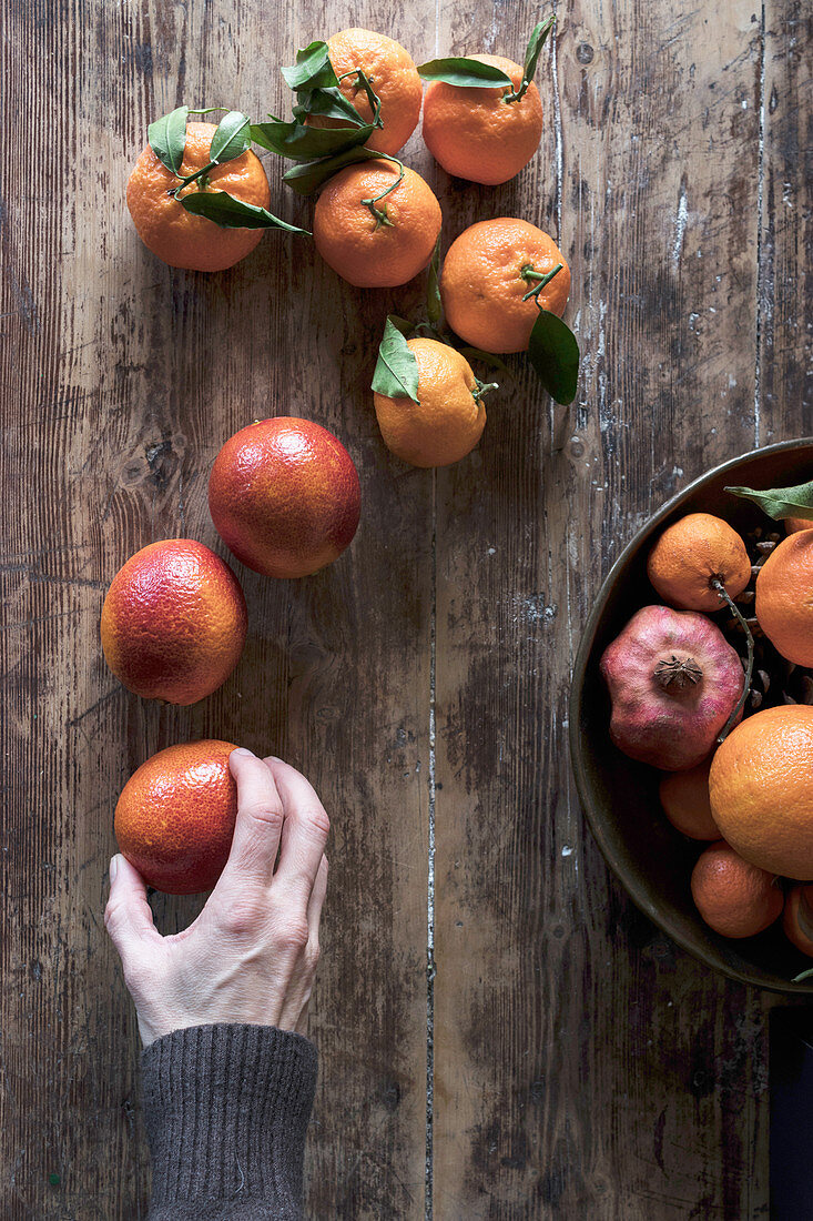 Fresh citrus fruits on a wooden table