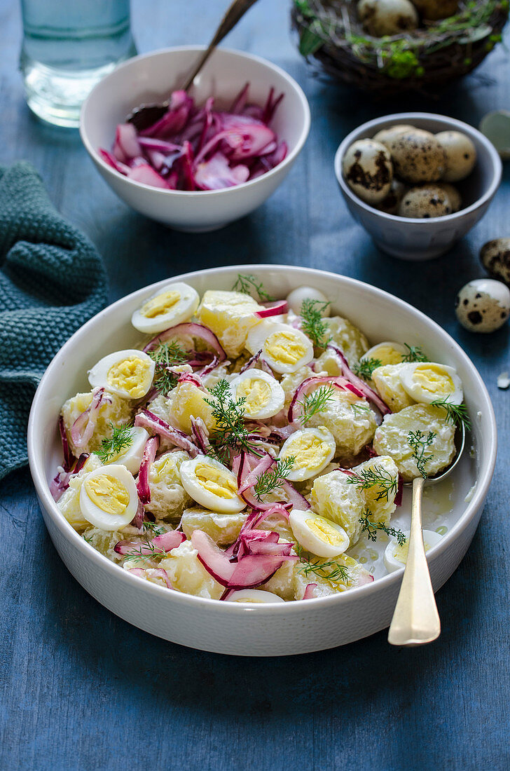 Potato and quail egg salad with pickled onions