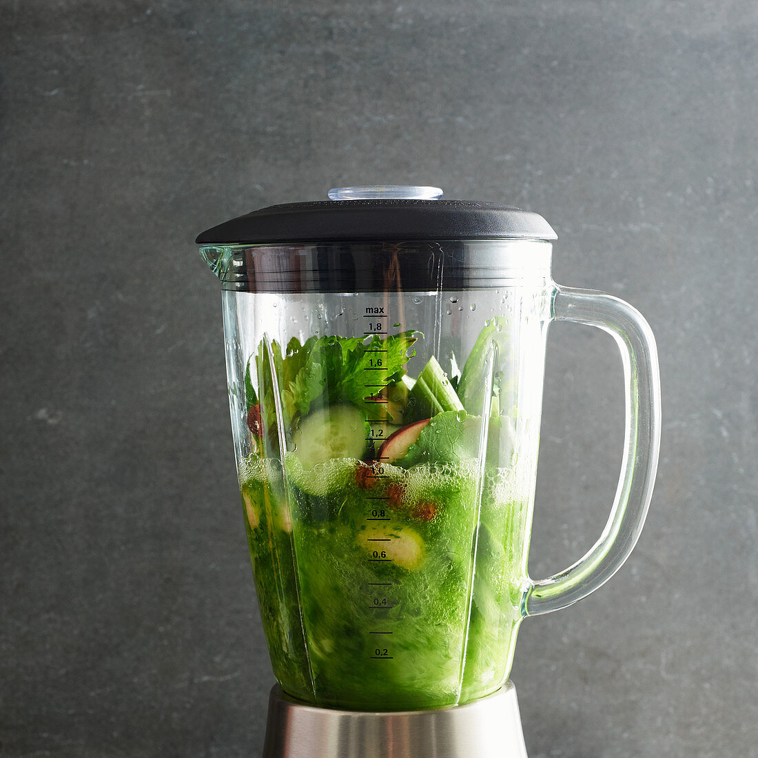 Smoothie ingredients being mixed in a blender