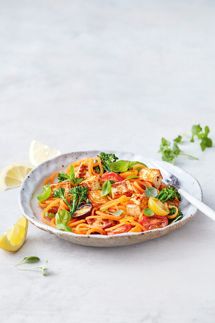 Sweet potato pasta with halloumi, bacon, broccolini and tomatoes