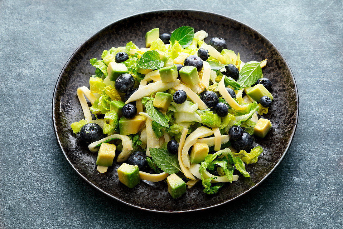 Cheese salad with blueberries and avocado