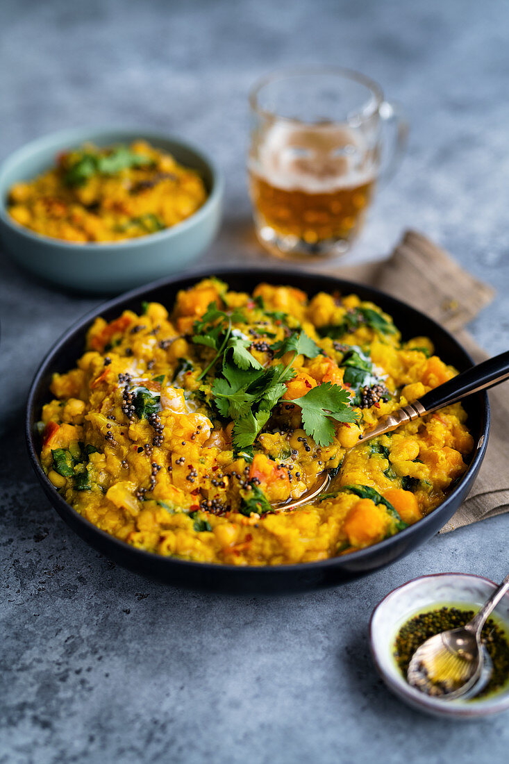 Vegan dal with red lentils, squash, chickpeas and spinach (India)