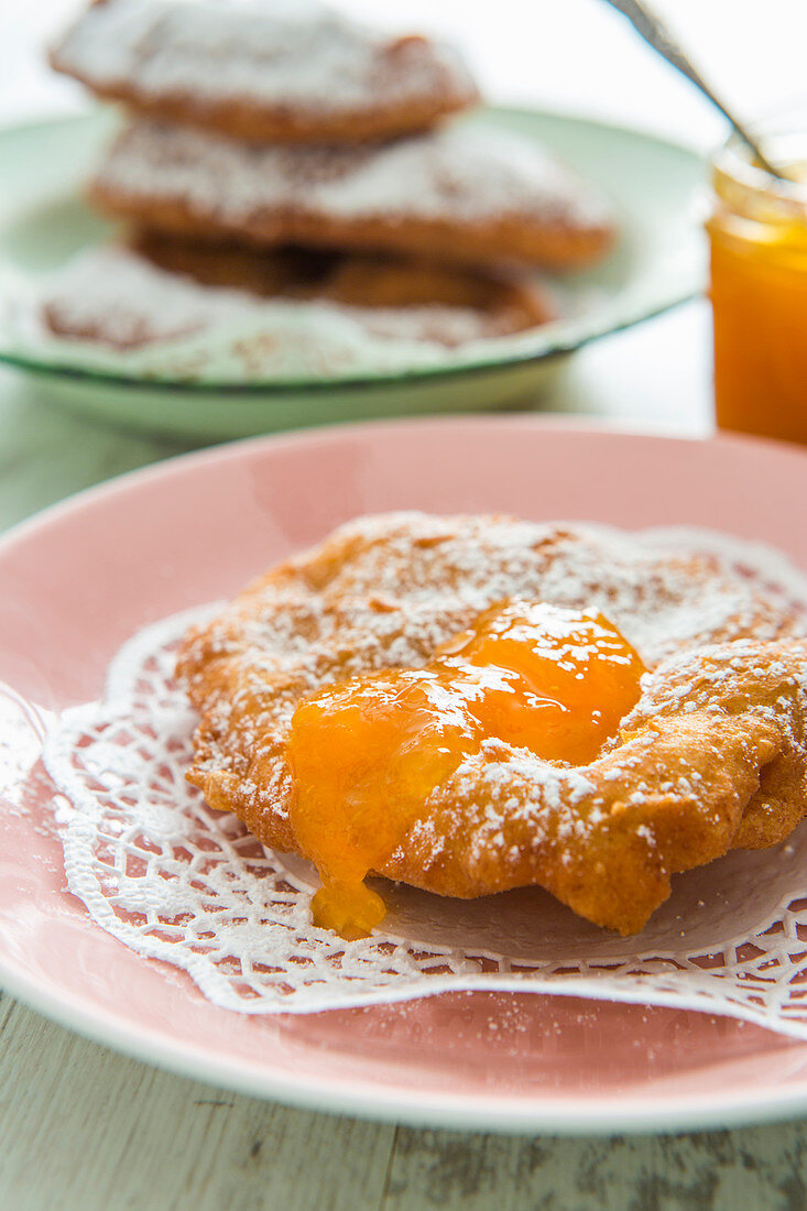 A Bauernkrapfen (Austrian yeast dough pastry) with jam