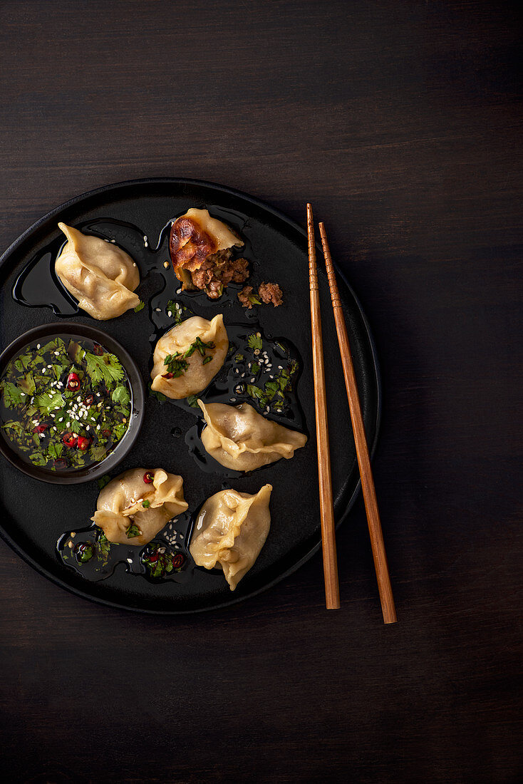 Oriental pork dumplings with pork, ginger, spring onion and soy sauce, coriander