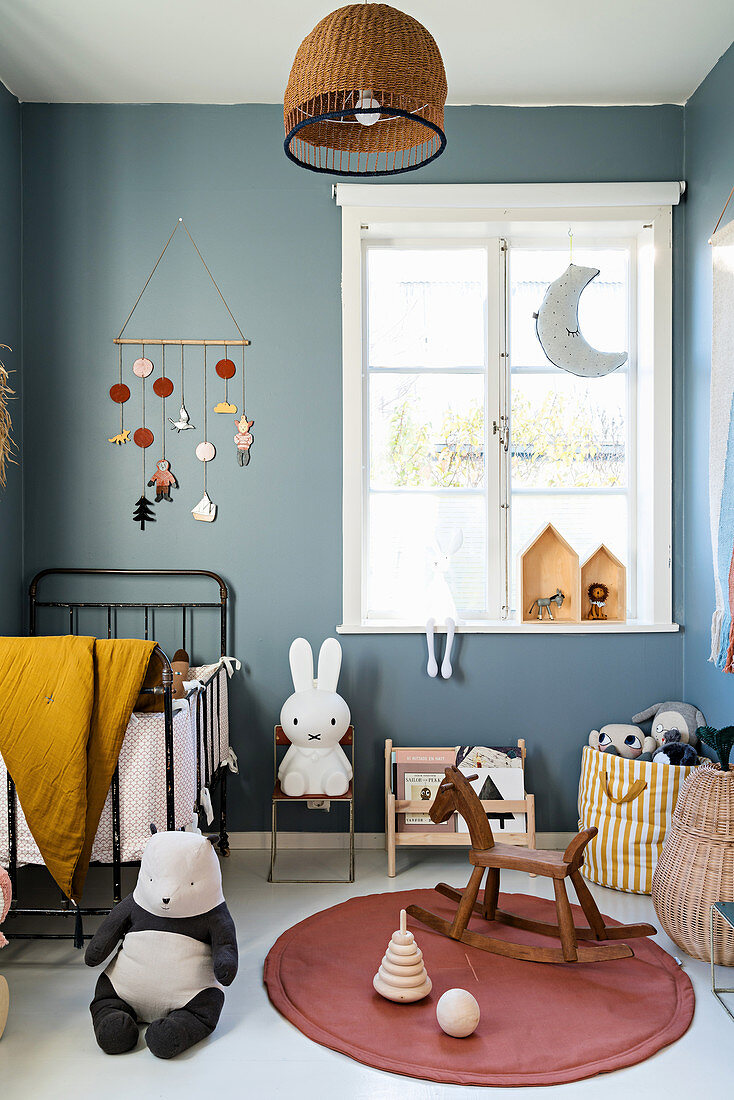 Vintage-style nursery with blue-grey walls