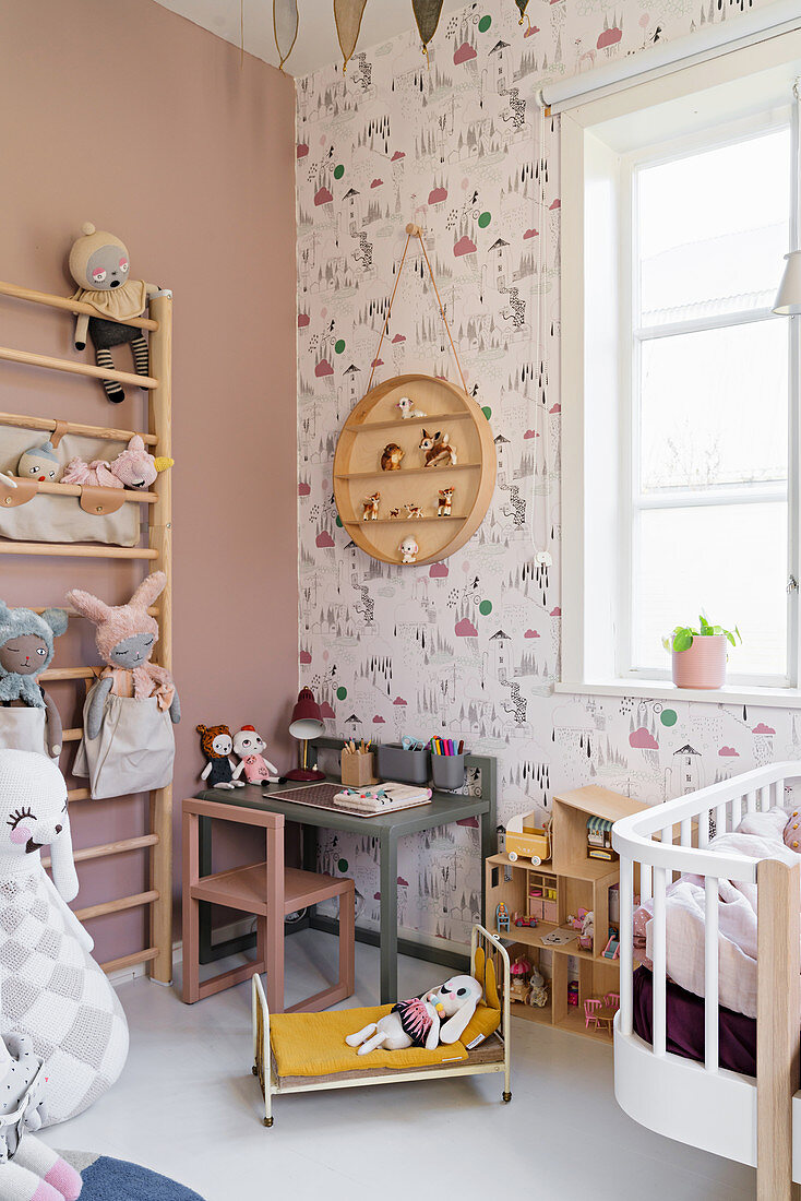 Wall bars and play table in vintage-style girl's bedroom