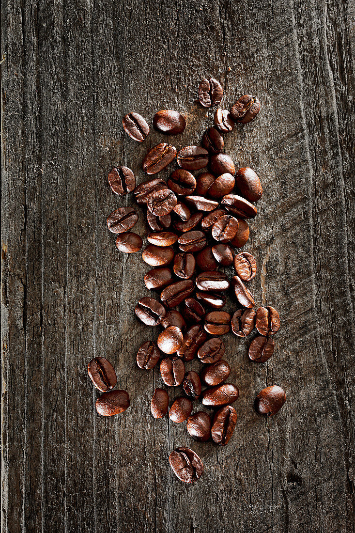 Coffee beans on wooden background