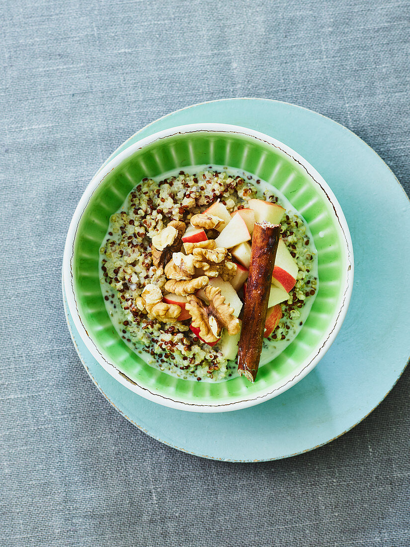 Quinoa breakfast bowl with apples and walnuts