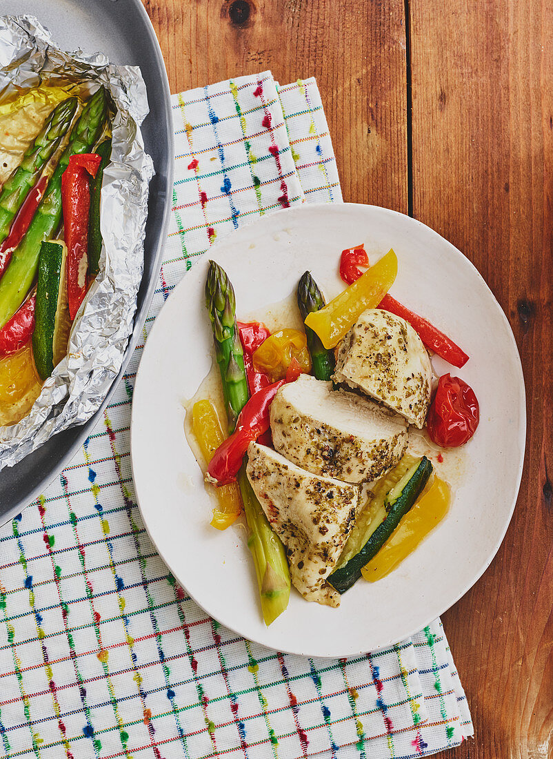 Chicken and vegetables baked in foil