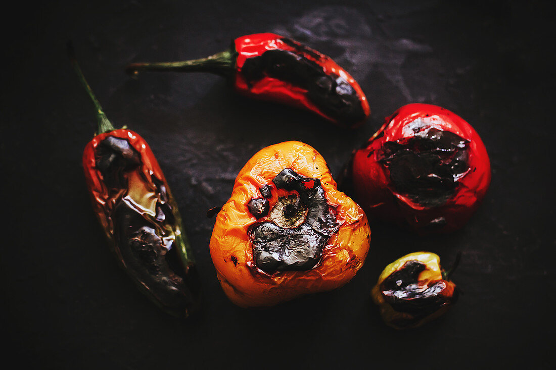 Roasted vegetables placed on black tray in kitchen