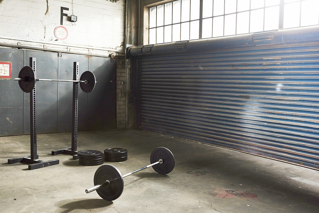 Barbells and weight plates in a gym