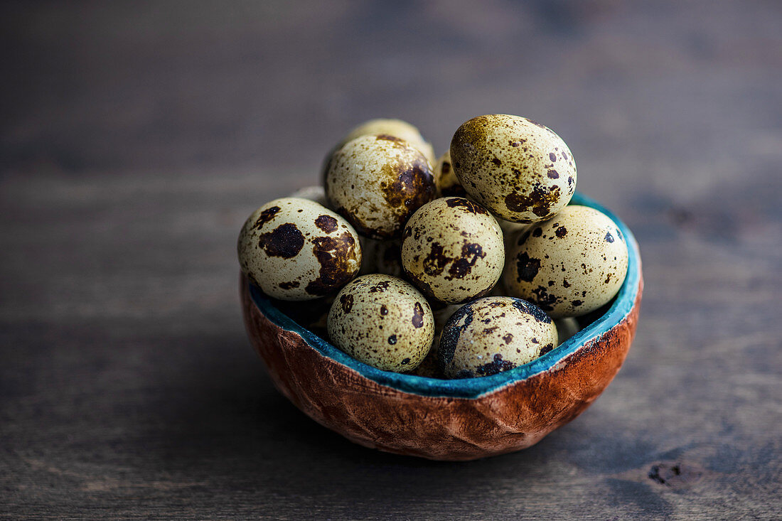 Common quail eggs in a bowl