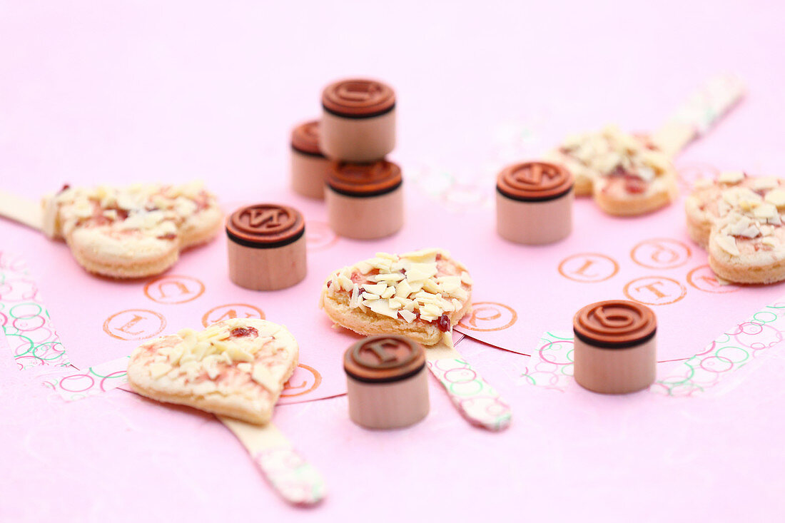 Raspberry and coconut hearts on sticks