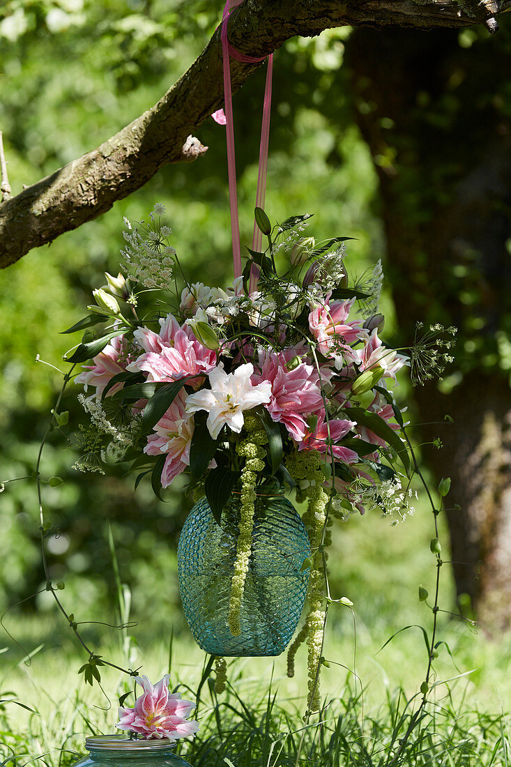 Hanging vase with lilies