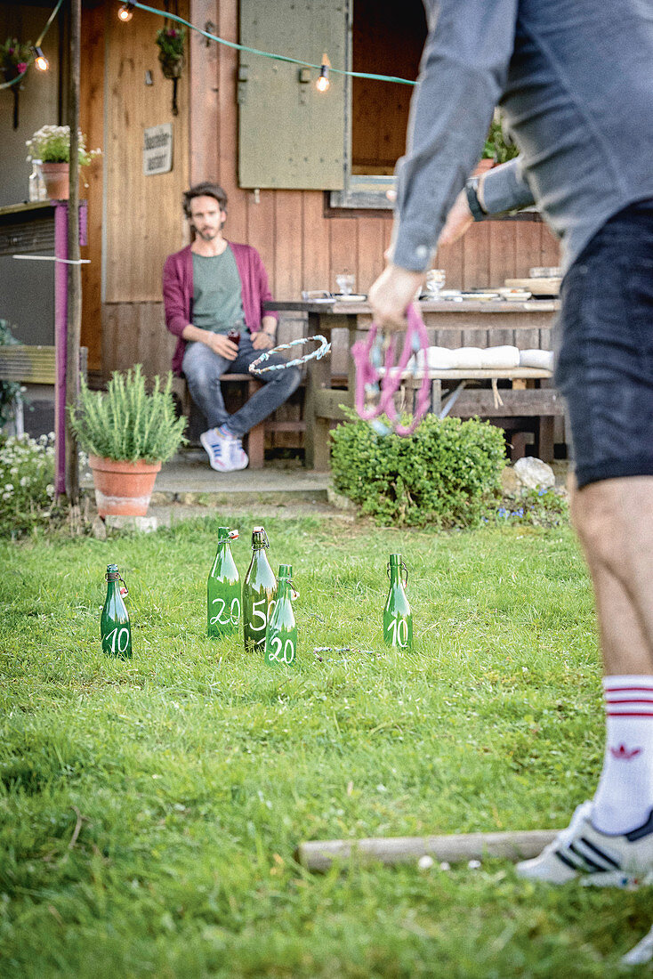 Men playing quoits in garden