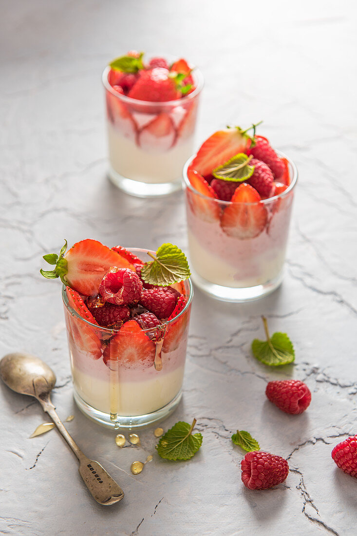 Vanilla and strawberry greek yoghurt with fresh berries and honey