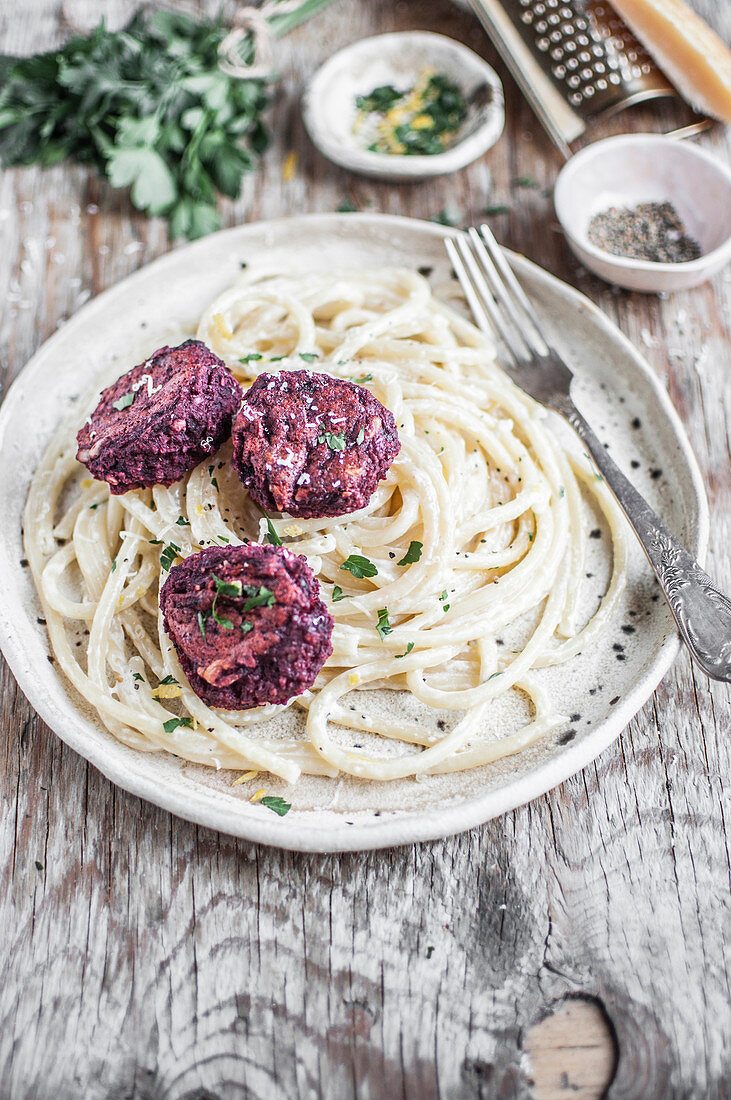 Vegan beetroot balls with alfredo pasta