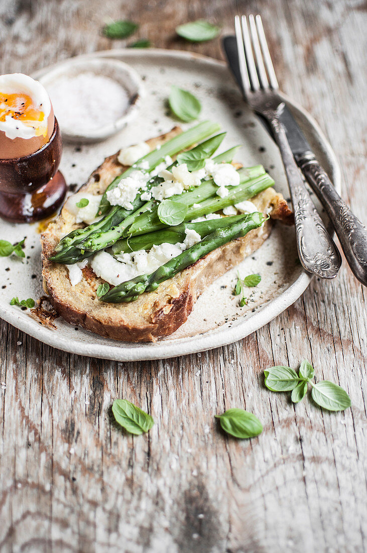 French toast with asparagus, goat cheese and fresh herbs served with soft boiled egg