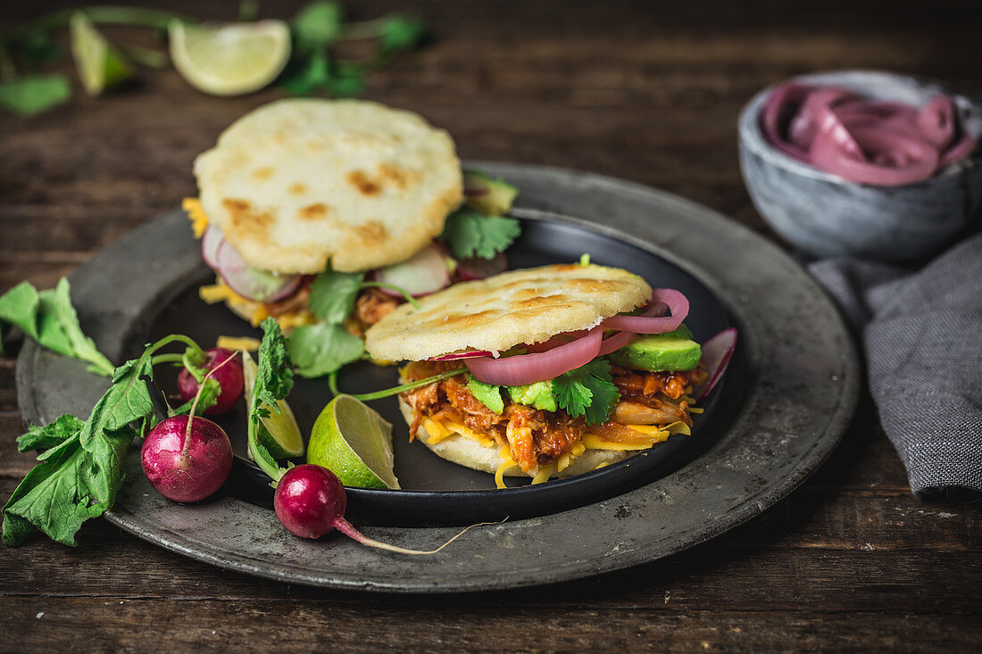 Arepas with chicken and sauce