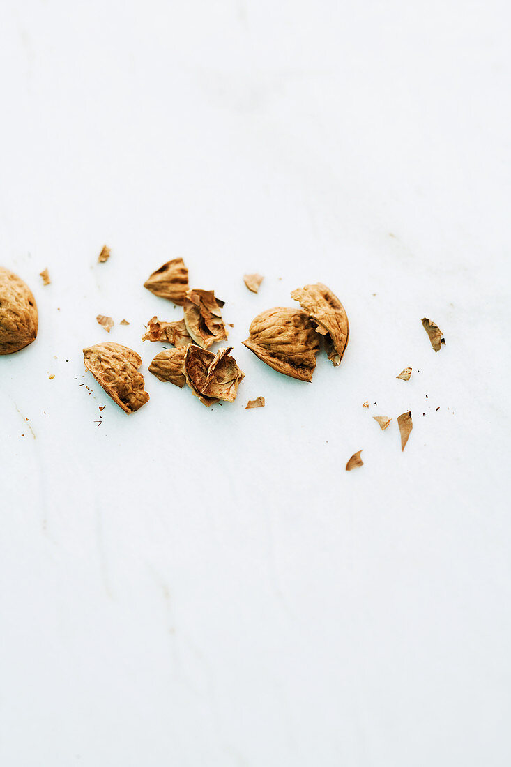 Walnut shells on a marble surface