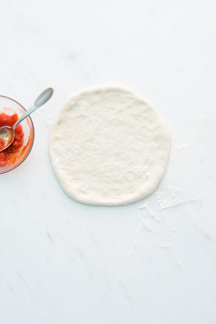 Pizza dough and tomato sauce
