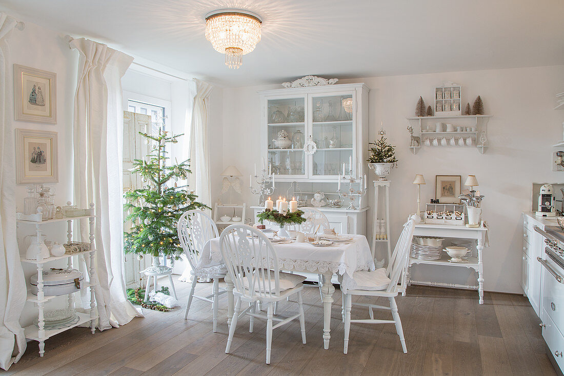 Vintage-style kitchen-dining room decorated entirely in white