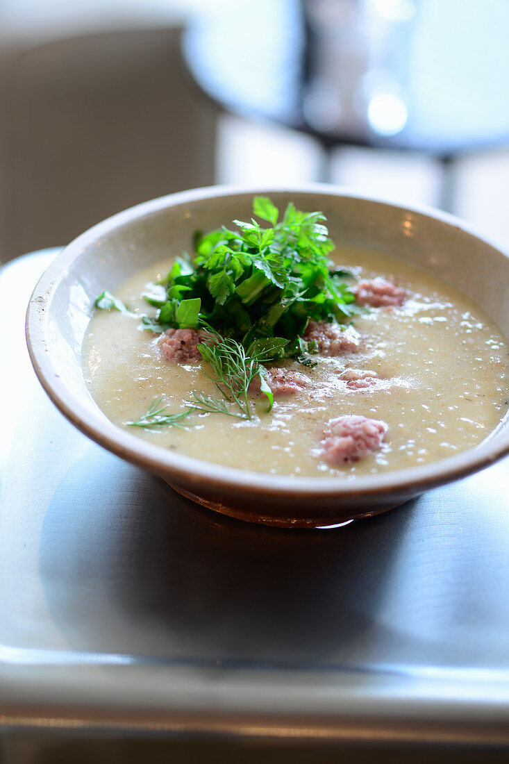 Wild herb and potato soup with salsiccia