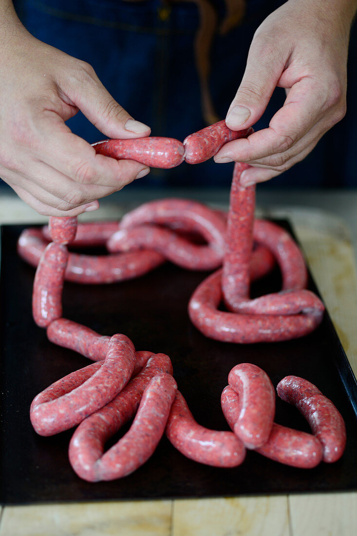 Sausages being made