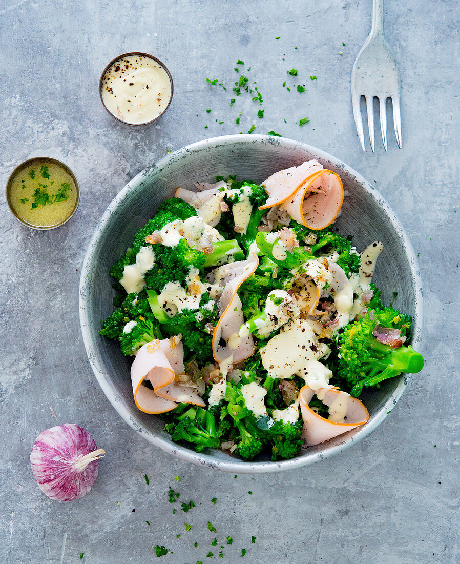 Broccoli salad with dressing and turkey breast