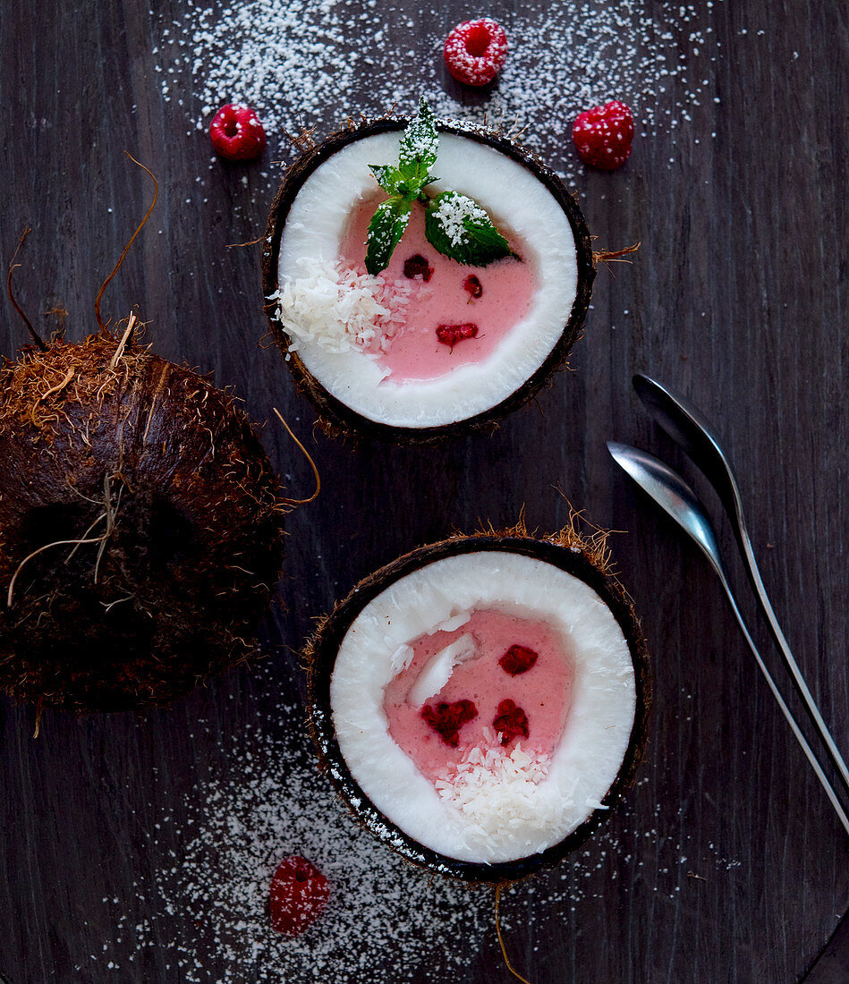Coconut halves filled with raspberry cream