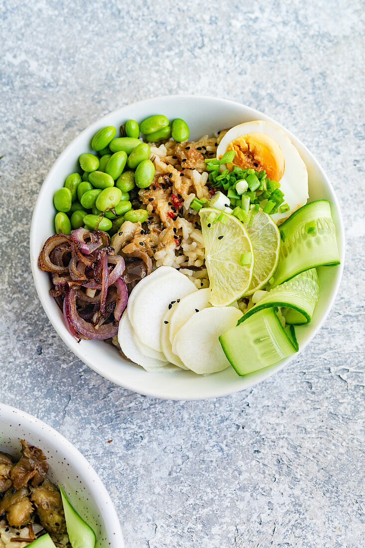 Vegetarian lunch bowl with marinated egg and edamame beans