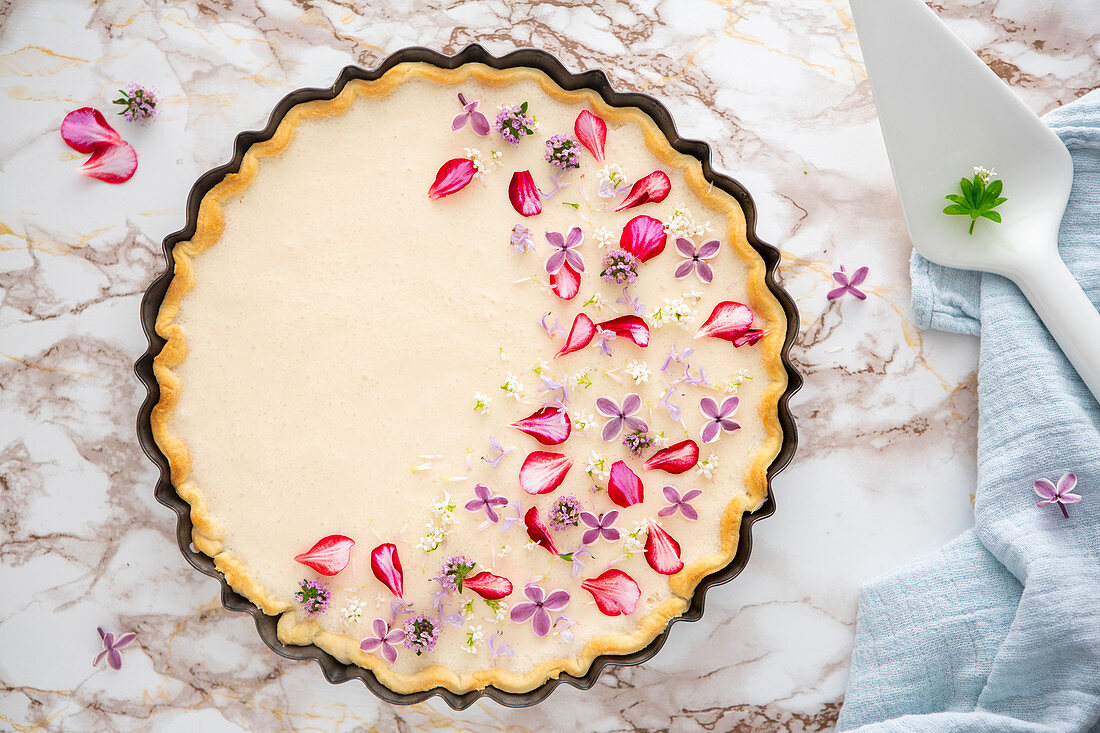 Lemonade tart with edible flowers