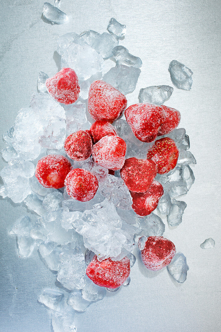 Frozen strawberries with ice cubes