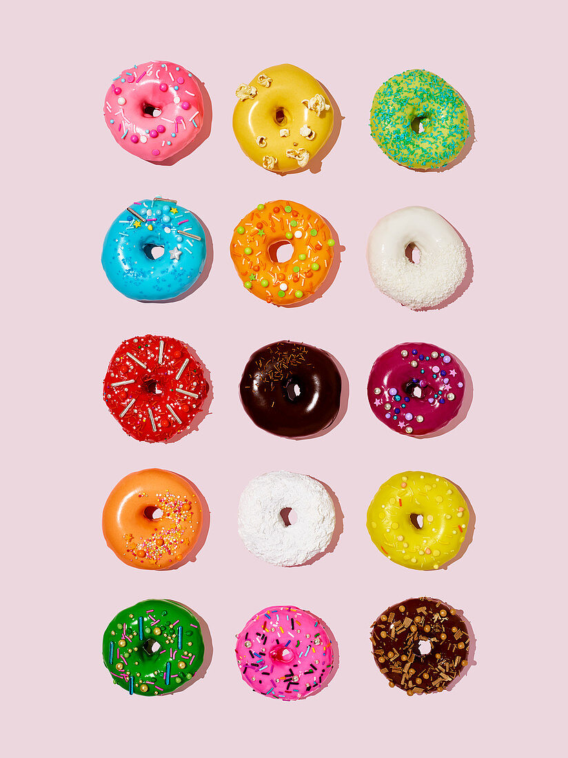 Lots of colourful glazed doughnuts